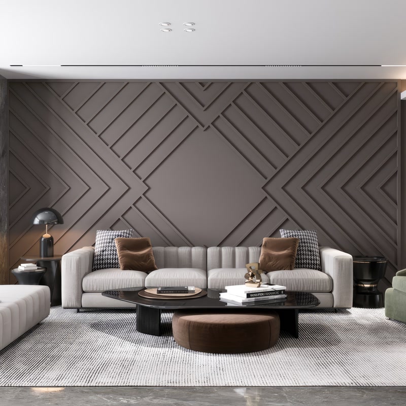 Profil Poliuretan P851350 pentru Amenajări Geometrice Perete Profilul din poliuretan P851350 este un element arhitectural de înaltă densitate, utilizat pentru crearea de casete și modele geometrice complexe pe pereții interiori. În această amenajare de living modern, structura decorativă a fost realizată prin îmbinarea riguroasă a baghetelor din poliuretan cu o densitate de peste 150-220 kg/m³ (țintă ~160 kg/m³), oferind o rezistență sporită la impactul mecanic accidental. Materialul prezintă o rezistență termică excelentă în intervalul de temperatură -100 °C / +80 °C, menținându-și stabilitatea dimensională fără dilatări structurale evidente în timp.

Montajul tehnic al acestui model geometric pe peretele accent necesită o trasare milimetrică prealabilă a liniilor de ghidaj și o debitare precisă la un unghi de 45 de grade pentru fiecare colț. Îmbinările dintre profilele P851350 se realizează folosind un adeziv de îmbinare structural pe bază de poliuretan, lăsând un rost tehnic fin de 1-2 mm care ulterior se finisează cu chit elastic acrilic. Suprafața profilului este pregătită prin șlefuire ușoară cu hârtie abrazivă de granulație 240, asigurând o aderență optimă pentru vopseaua lavabilă aplicată ulterior în nuanță închisă de vizon.

Alegerea poliuretanului de înaltă densitate în defavoarea ipsosului tradițional sau a MDF-ului oferă avantaje decisive pentru echipele de montaj și beneficiari. Spre deosebire de MDF, profilul poliuretanic P851350 are o rată de absorbție a apei de sub 0.5%, ceea ce previne umflarea sau deformarea cauzată de umiditatea ambientală din încăpere. Față de ipsos, poliuretanul este considerabil mai ușor, reduce sarcina pe peretele de compartimentare și nu se crapă la micile mișcări structurale ale clădirii, facilitând un proces de instalare curat și rapid.

Efectul tridimensional al peretelui este accentuat de interacțiunea dintre reliefurile geometrice din poliuretan și sistemul liniar de iluminat aplicat pe tavan. Vopsirea integrală a profilelor P851350 și a peretelui în aceeași nuanță mată creează un joc continuu de umbre și lumini fără îmbinări vizibile. Pentru un rezultat impecabil pe termen lung, se recomandă aplicarea a două straturi uniforme de vopsea acrilică sau latex, protejând profilele împotriva depunerilor de praf și facilitând întreținerea periodică prin ștergere umedă.