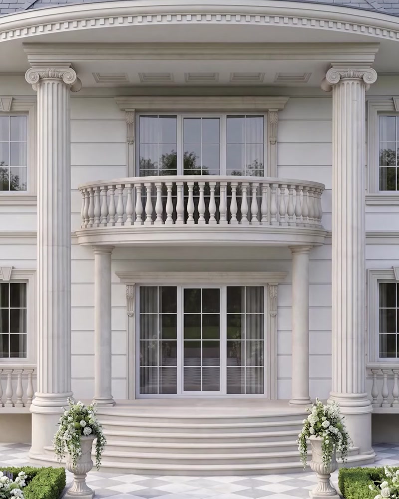 Vilă albă cu coloane și balustradă decorativă la fațadă